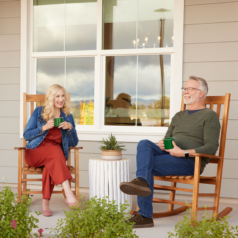 Couple in rocking chairs on porch